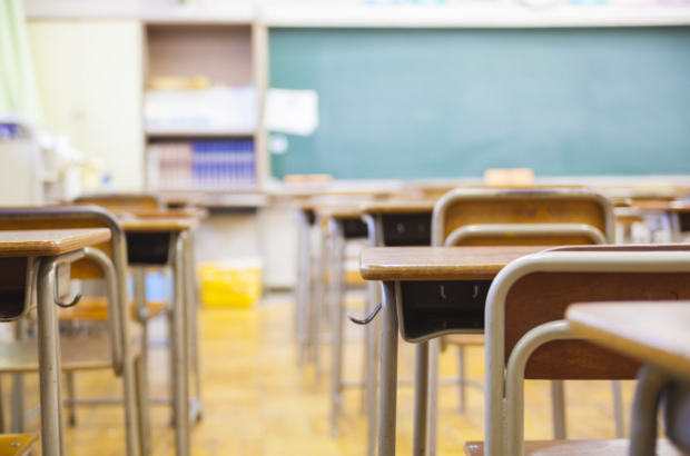 An empty school classroom defocused.